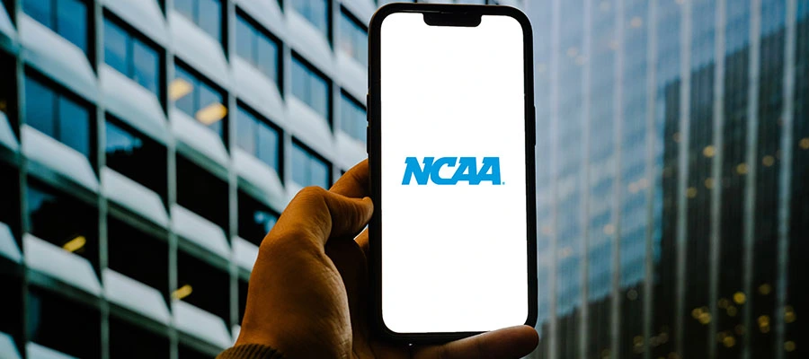 College athlete reviewing NIL contract with legal advisor.